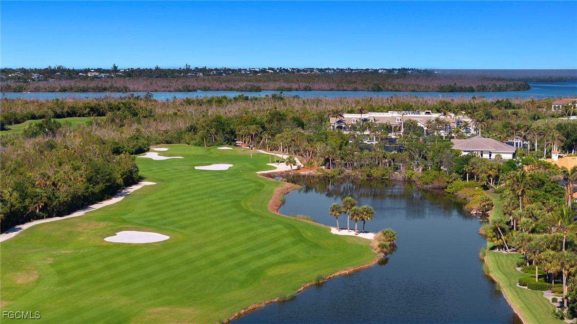 2619 Wulfert Road, Unit 1 Sanibel, FL 33957 - Photo 34 of 35 a view of a lake with houses in the background