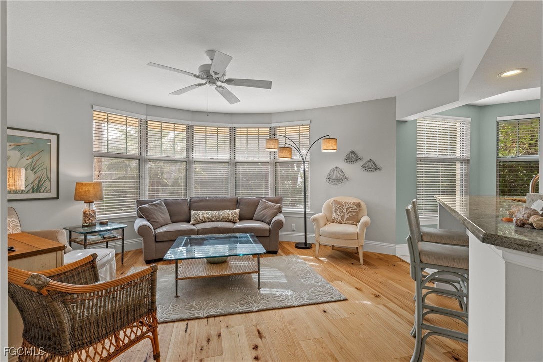 2619 Wulfert Road, Unit 1 Sanibel, FL 33957 - Photo 9 of 35 a living room with furniture and a large window