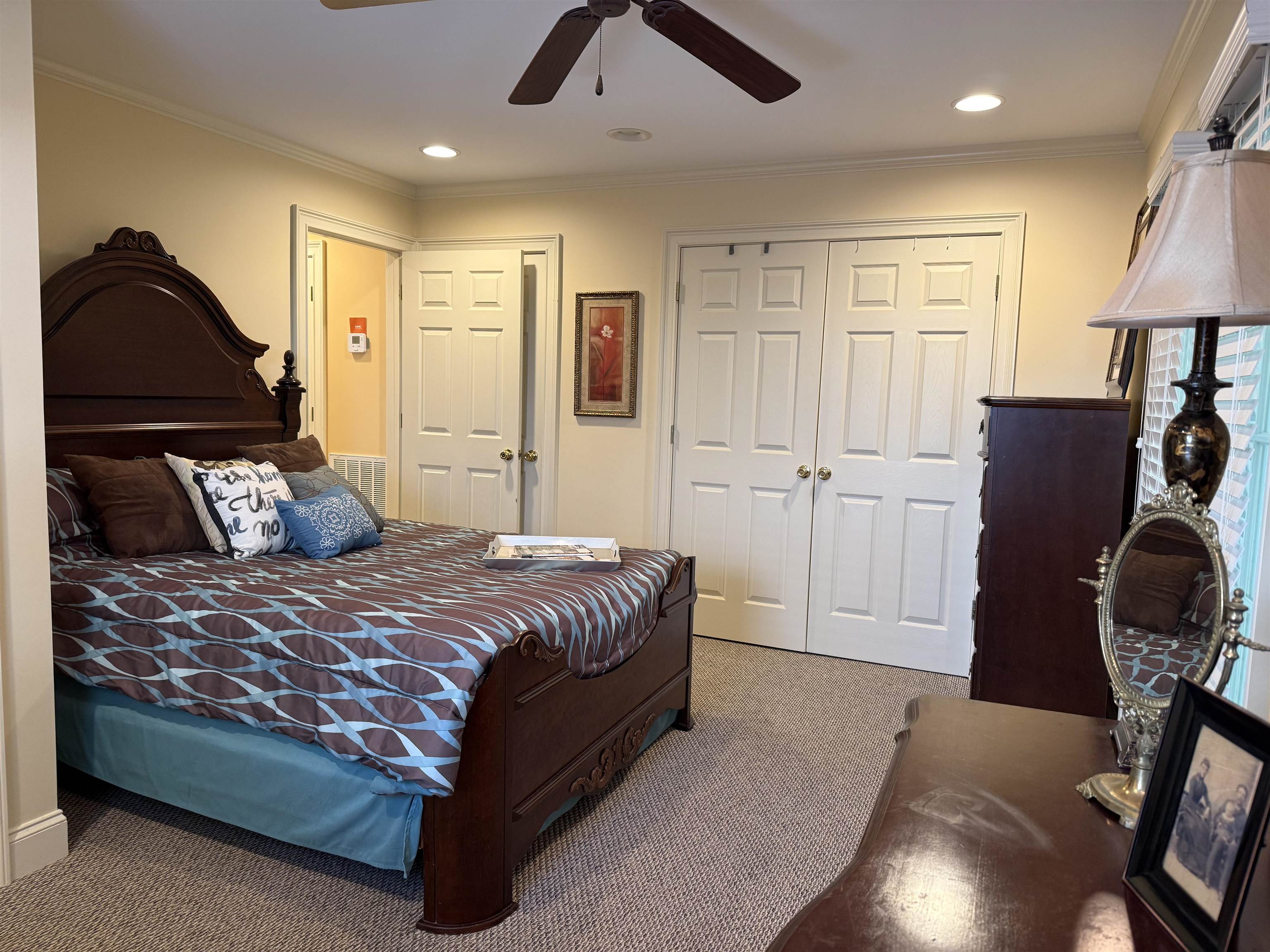 14 Patsy Path Iuka, MS 38852 - Photo 15 of 33 Bedroom with crown molding, ceiling fan, visible vents, a closet, and carpet floors
