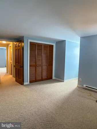 an empty room with closet area