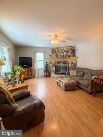 a living room with furniture and a fireplace