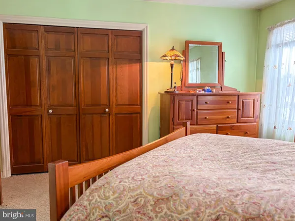 a bedroom with a bed and furniture