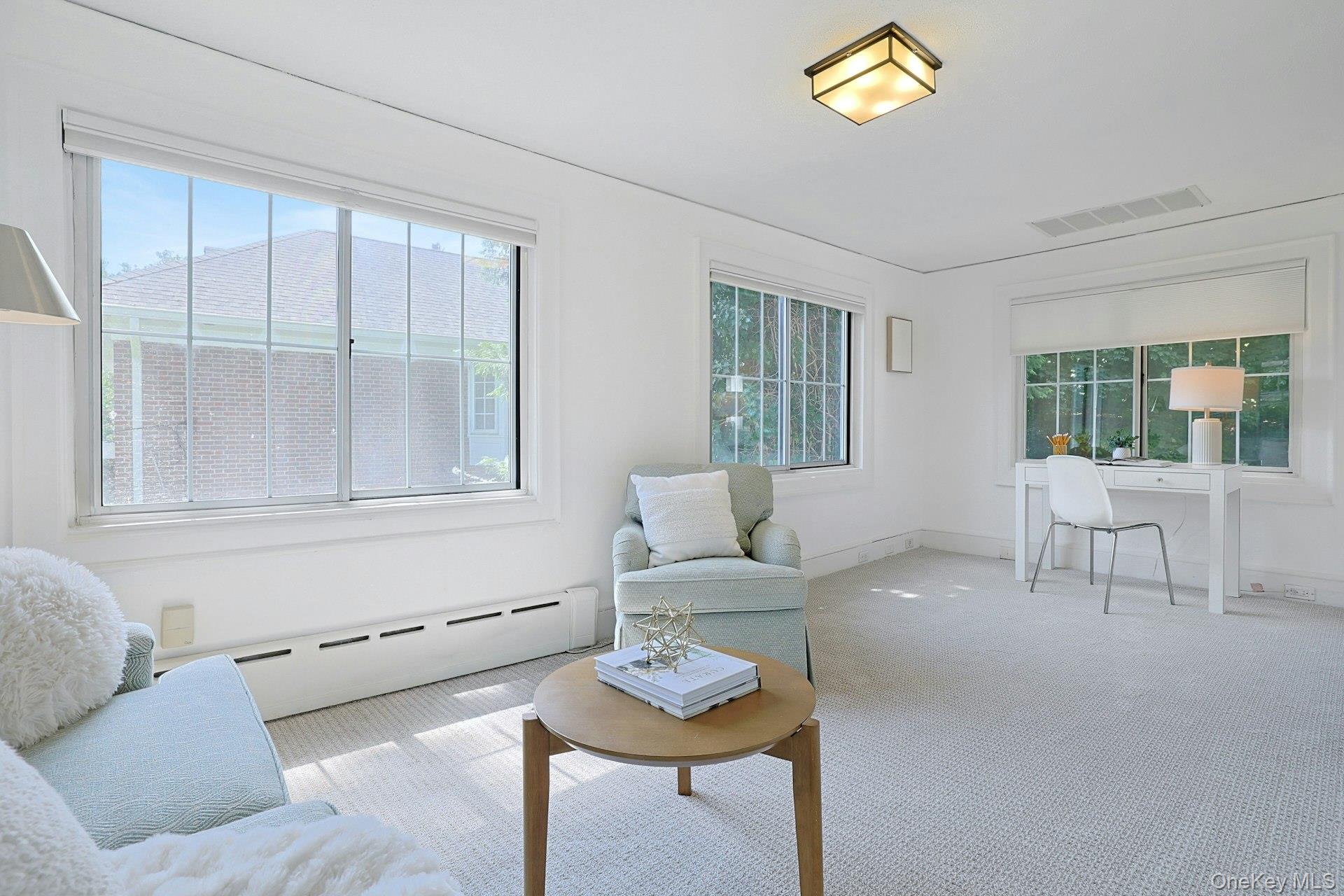 17 Elm Road Scarsdale, NY 10583 - Photo 23 of 38 Another view of the sunny study highlights its generous proportions and versatility as a lounge, office or quiet reading space.