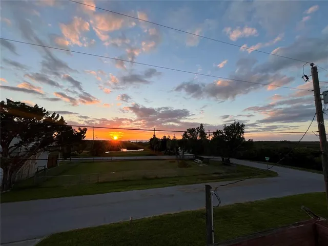 a view of a street with a yard