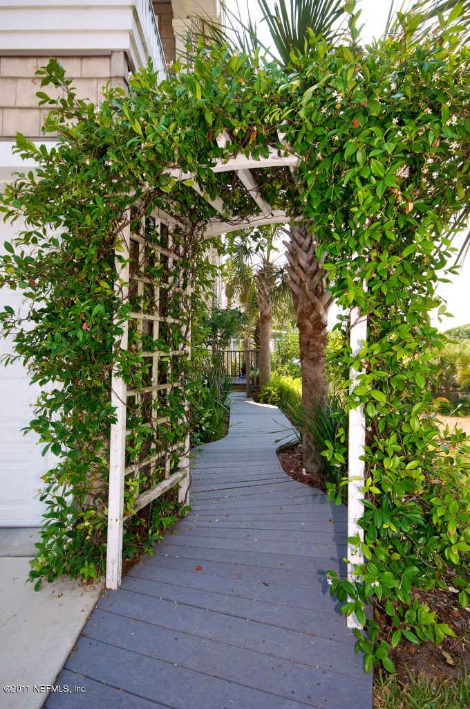 1960 Beach Avenue Atlantic Beach, FL 32233 - Photo 2 of 28 a view of a pathway with a tree