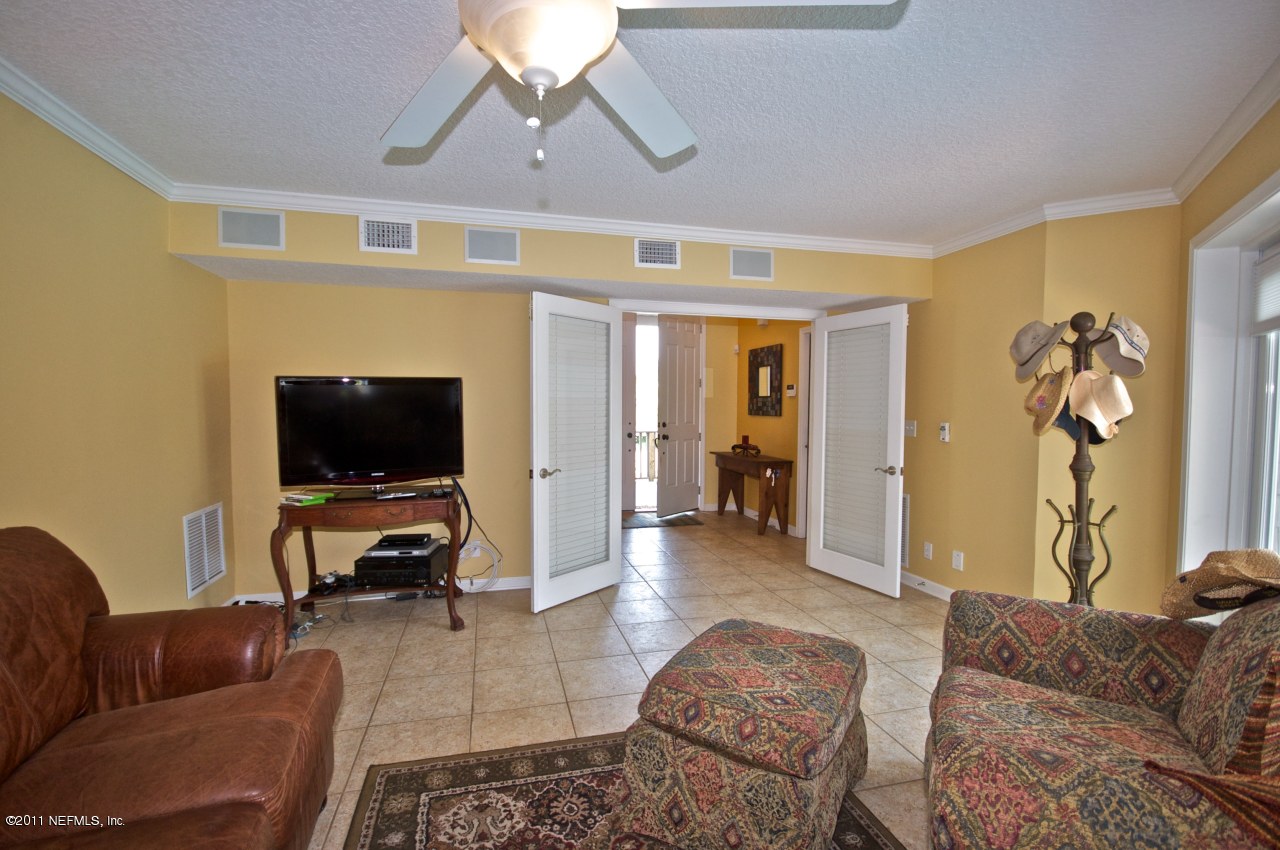 1960 Beach Avenue Atlantic Beach, FL 32233 - Photo 21 of 28 a living room with furniture and a flat screen tv