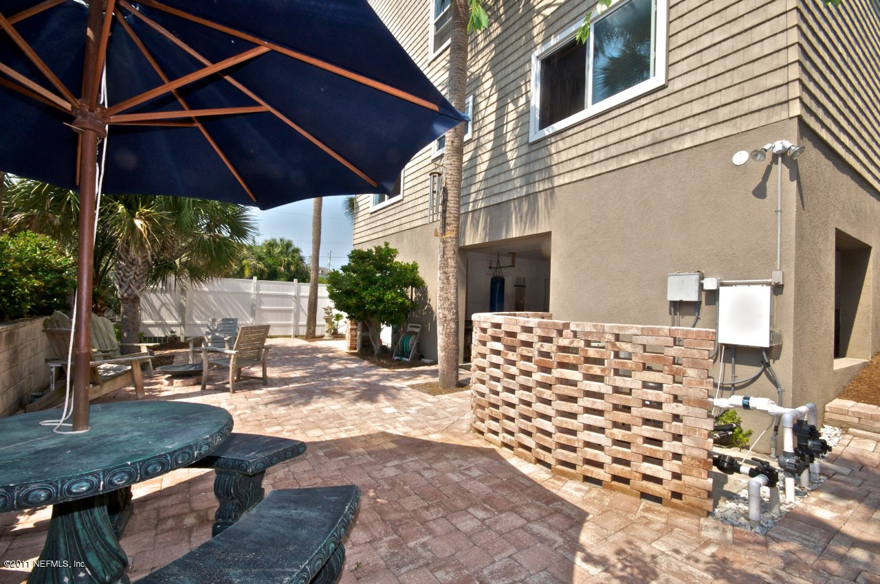 1960 Beach Avenue Atlantic Beach, FL 32233 - Photo 27 of 28 a patio with table and chairs