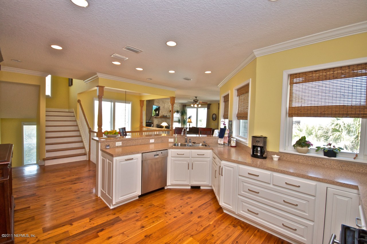 1960 Beach Avenue Atlantic Beach, FL 32233 - Photo 9 of 28 a large kitchen with a large counter top appliances and cabinets
