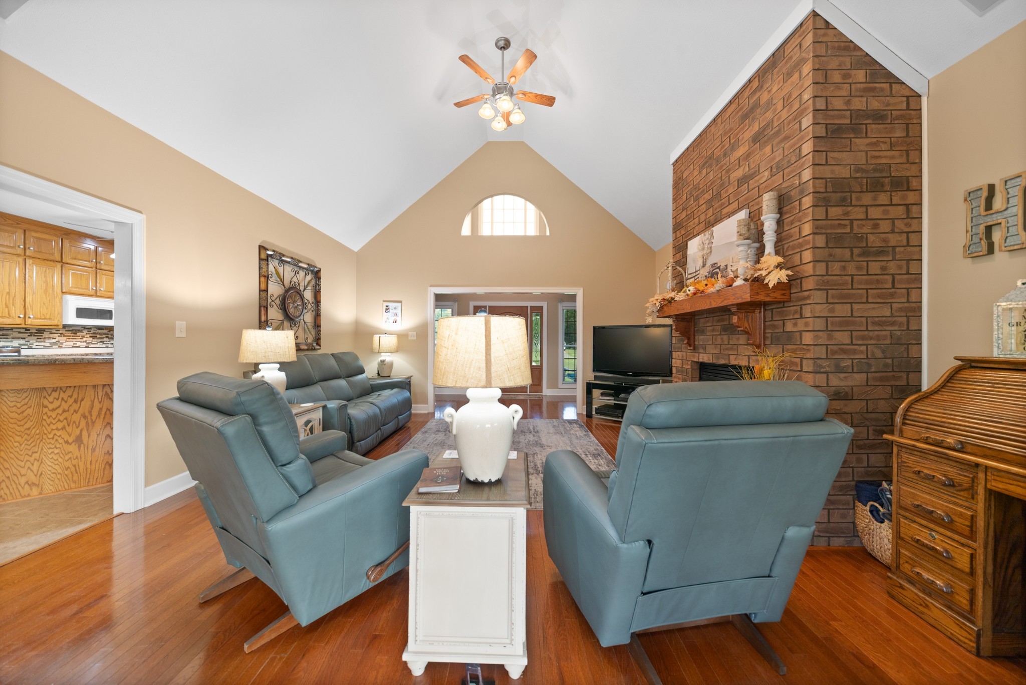 1642 Caughran Road Lewisburg, TN 37091 - Photo 15 of 92 a living room with furniture a fireplace and a flat screen tv