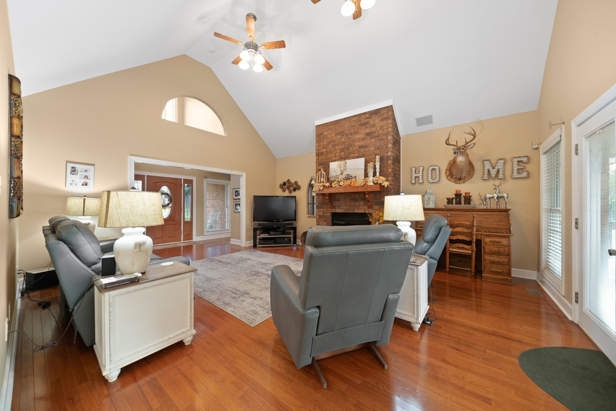 1642 Caughran Road Lewisburg, TN 37091 - Photo 17 of 92 a living room with fireplace furniture and a flat screen tv