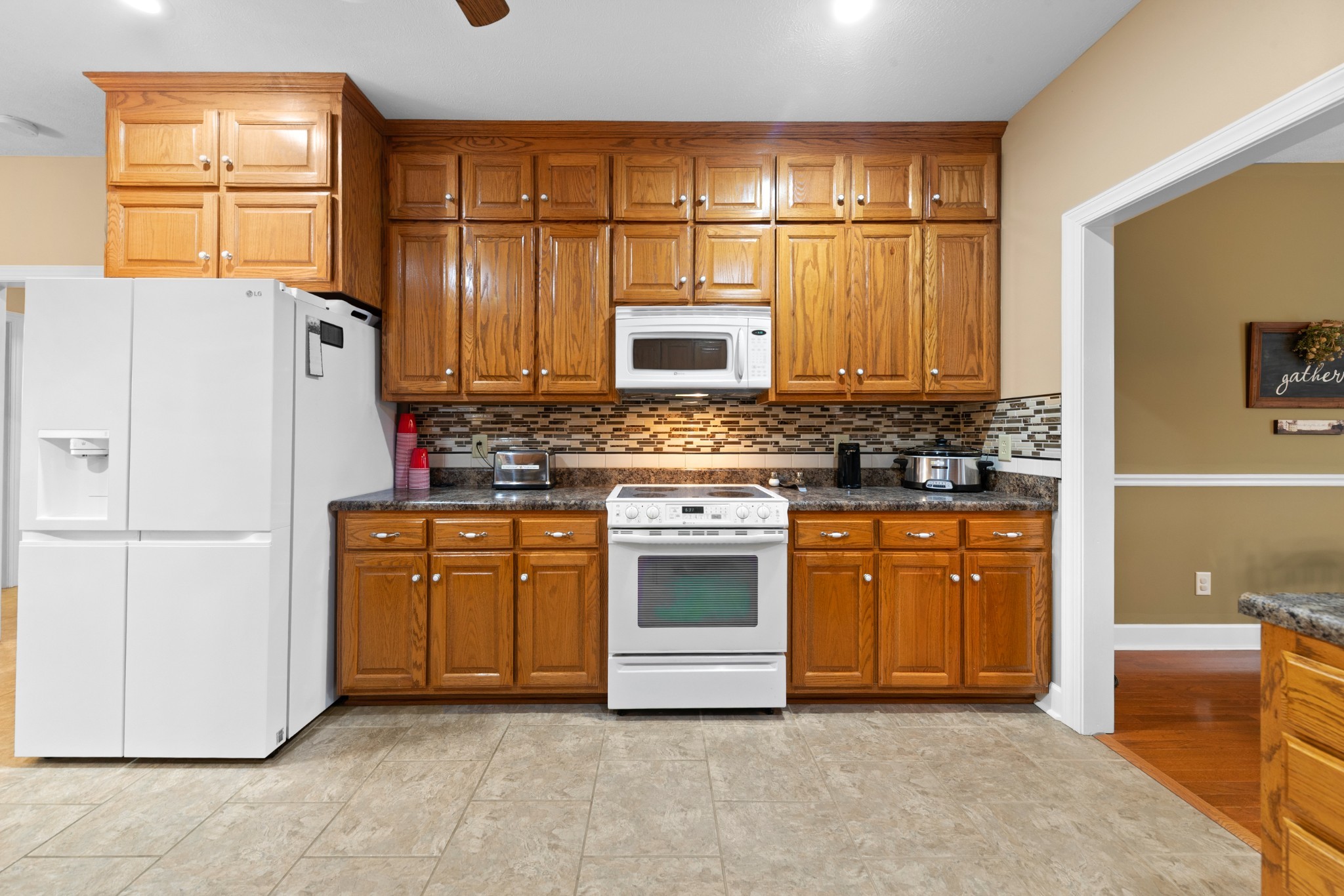 1642 Caughran Road Lewisburg, TN 37091 - Photo 19 of 92 a kitchen with stainless steel appliances granite countertop a refrigerator a stove a sink and dishwasher