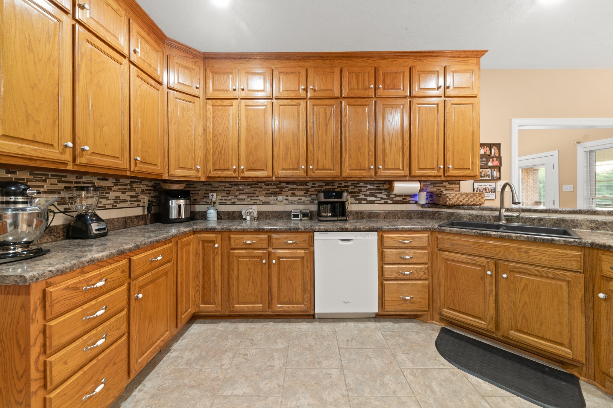 1642 Caughran Road Lewisburg, TN 37091 - Photo 20 of 92 a kitchen with stainless steel appliances granite countertop a sink a stove and white cabinets