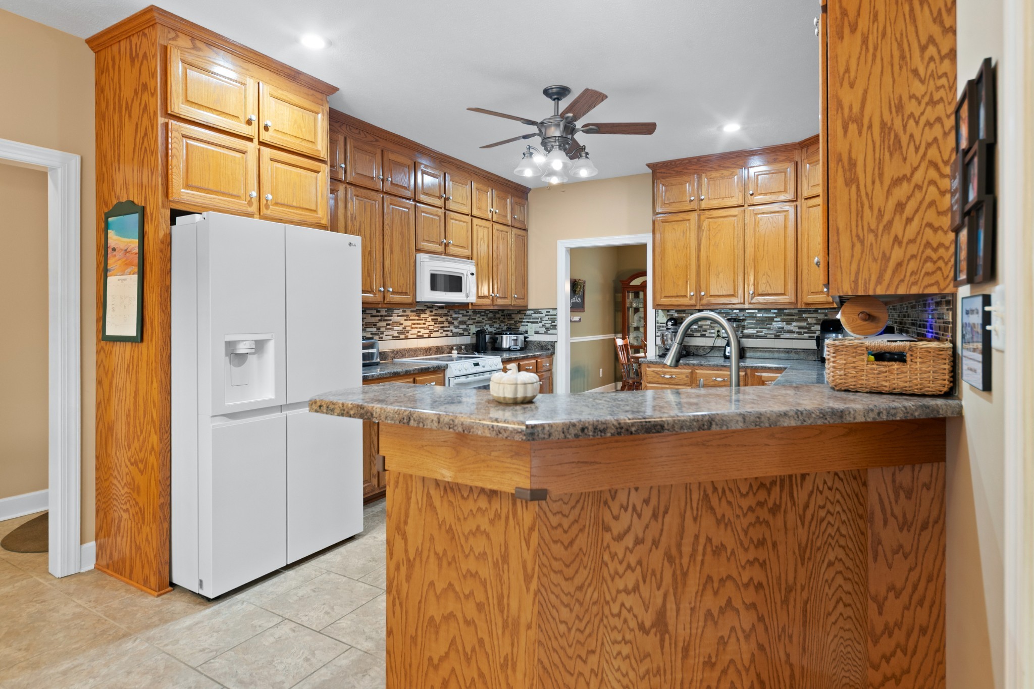 1642 Caughran Road Lewisburg, TN 37091 - Photo 22 of 92 a kitchen with stainless steel appliances granite countertop a sink a refrigerator and a refrigerator