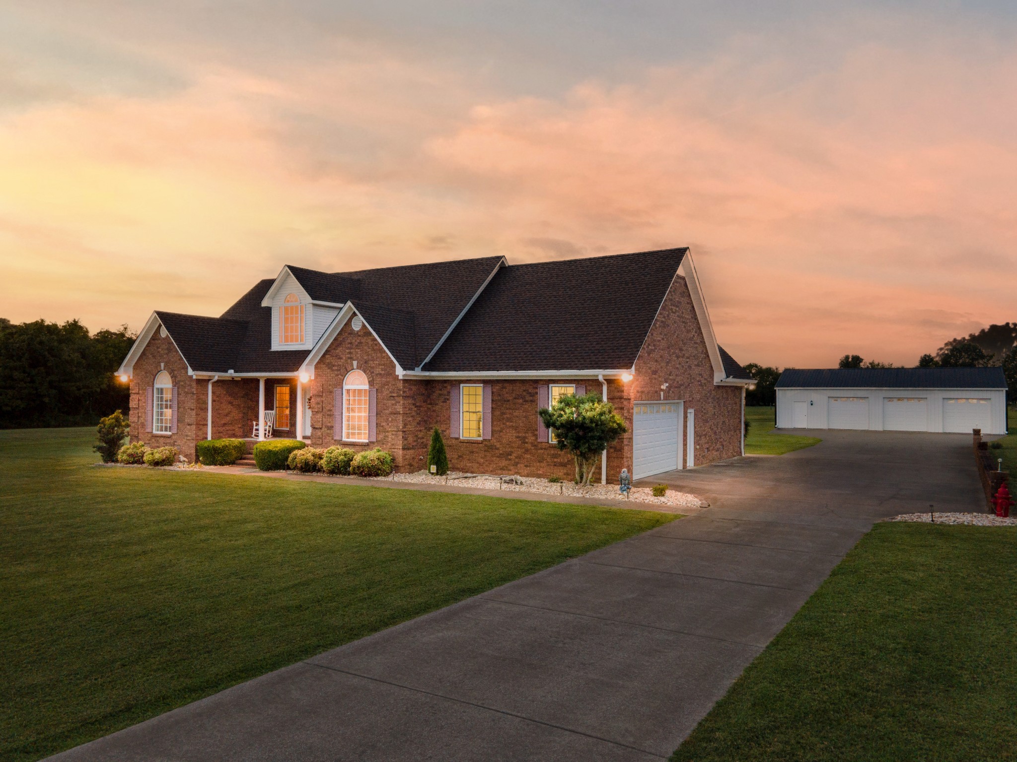 1642 Caughran Road Lewisburg, TN 37091 - Photo 3 of 92 a front view of a house with a yard and lake view