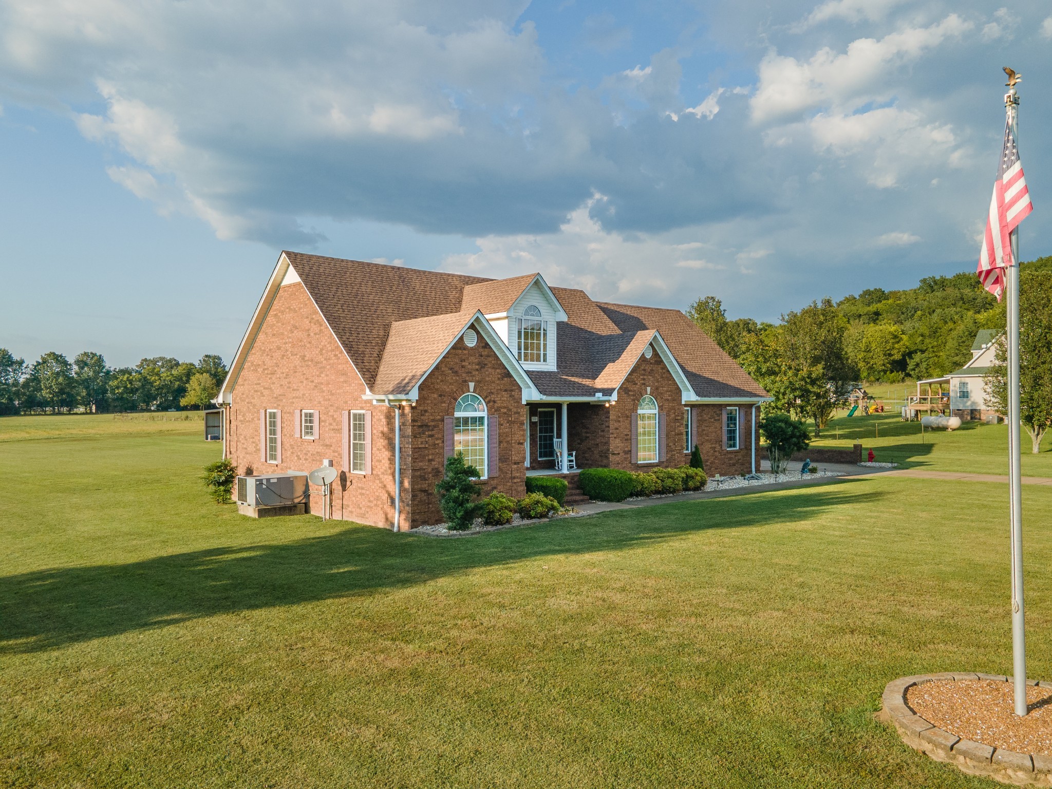 1642 Caughran Road Lewisburg, TN 37091 - Photo 4 of 92 a front view of a house with a garden and yard