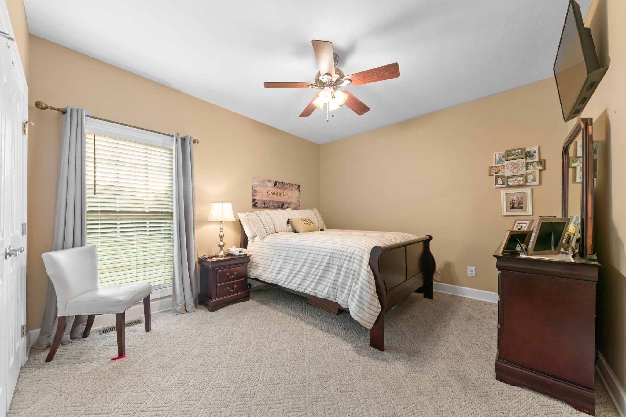 1642 Caughran Road Lewisburg, TN 37091 - Photo 41 of 92 a bedroom with a bed and a chandelier