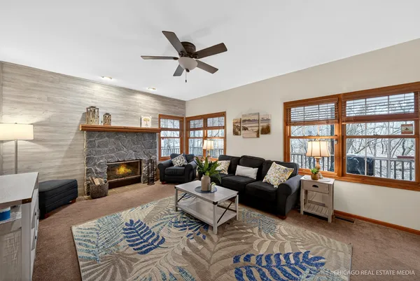 a living room with furniture and a fireplace