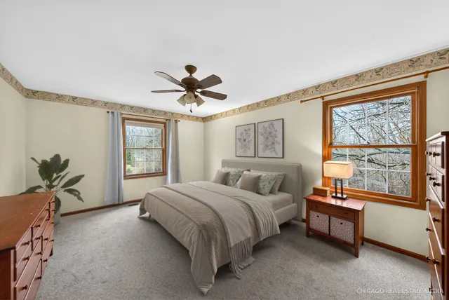 a spacious bedroom with a bed and a large window