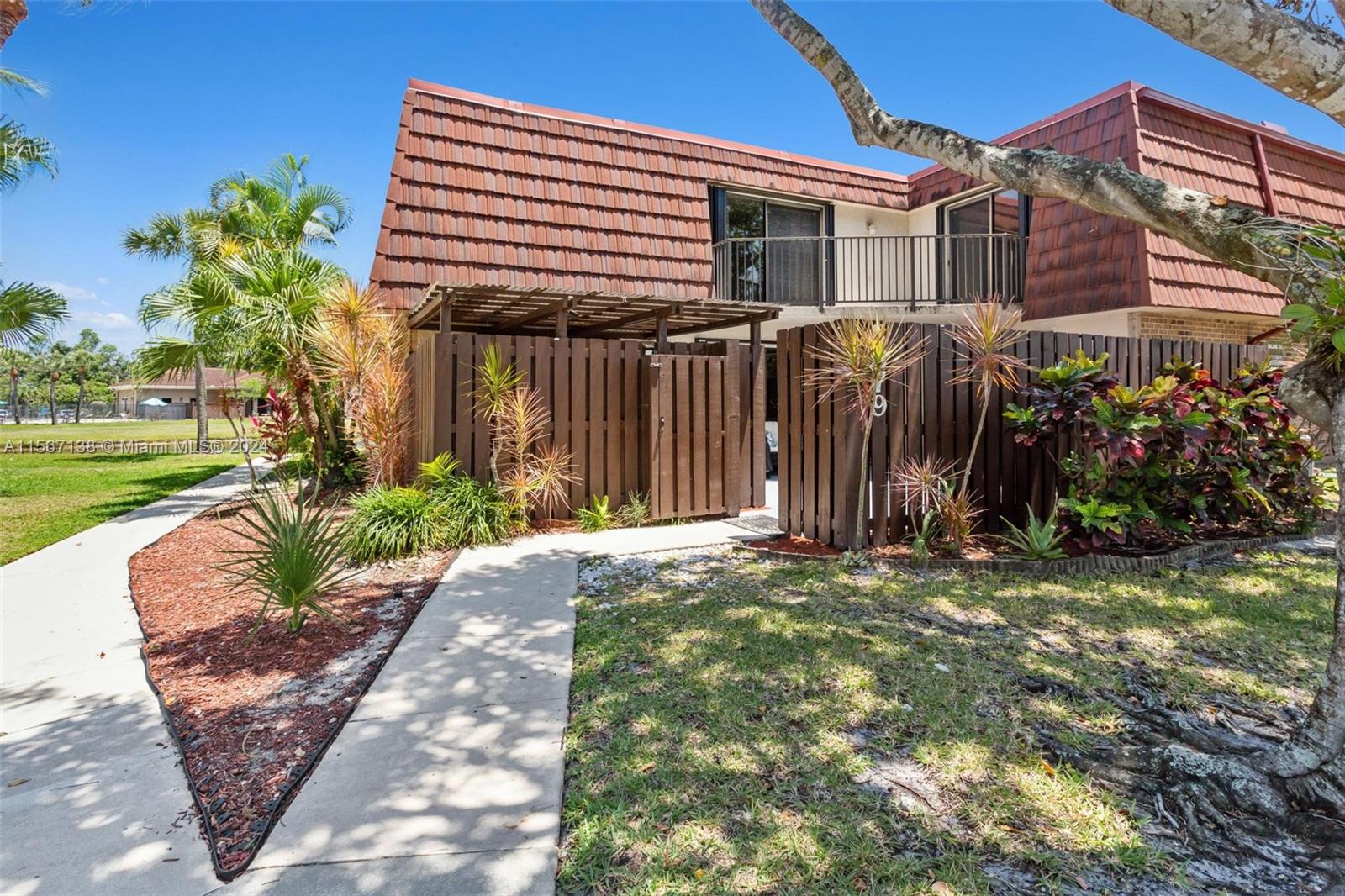 8379 Boca Rio Drive Boca Raton, FL 33433 - Photo 2 of 30 a view of a house with a yard