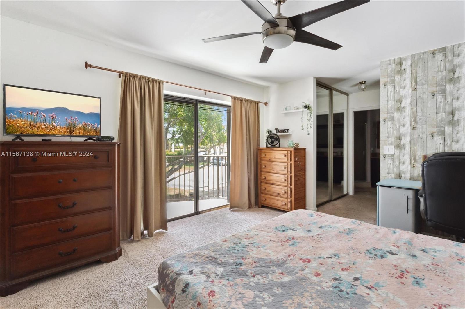 8379 Boca Rio Drive Boca Raton, FL 33433 - Photo 21 of 30 a bedroom with a bed and a television in it