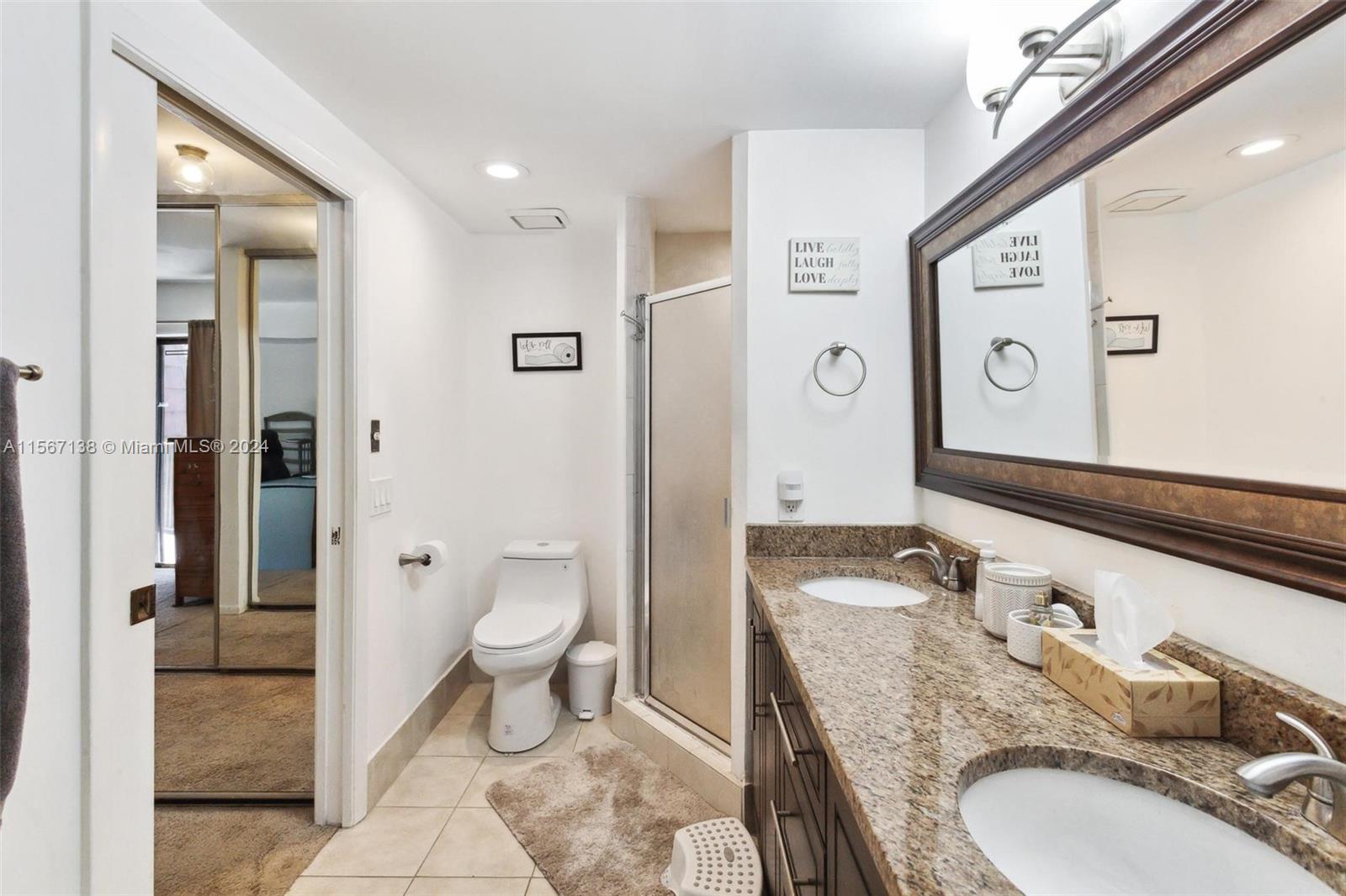 8379 Boca Rio Drive Boca Raton, FL 33433 - Photo 24 of 30 a bathroom with a granite countertop sink toilet and shower