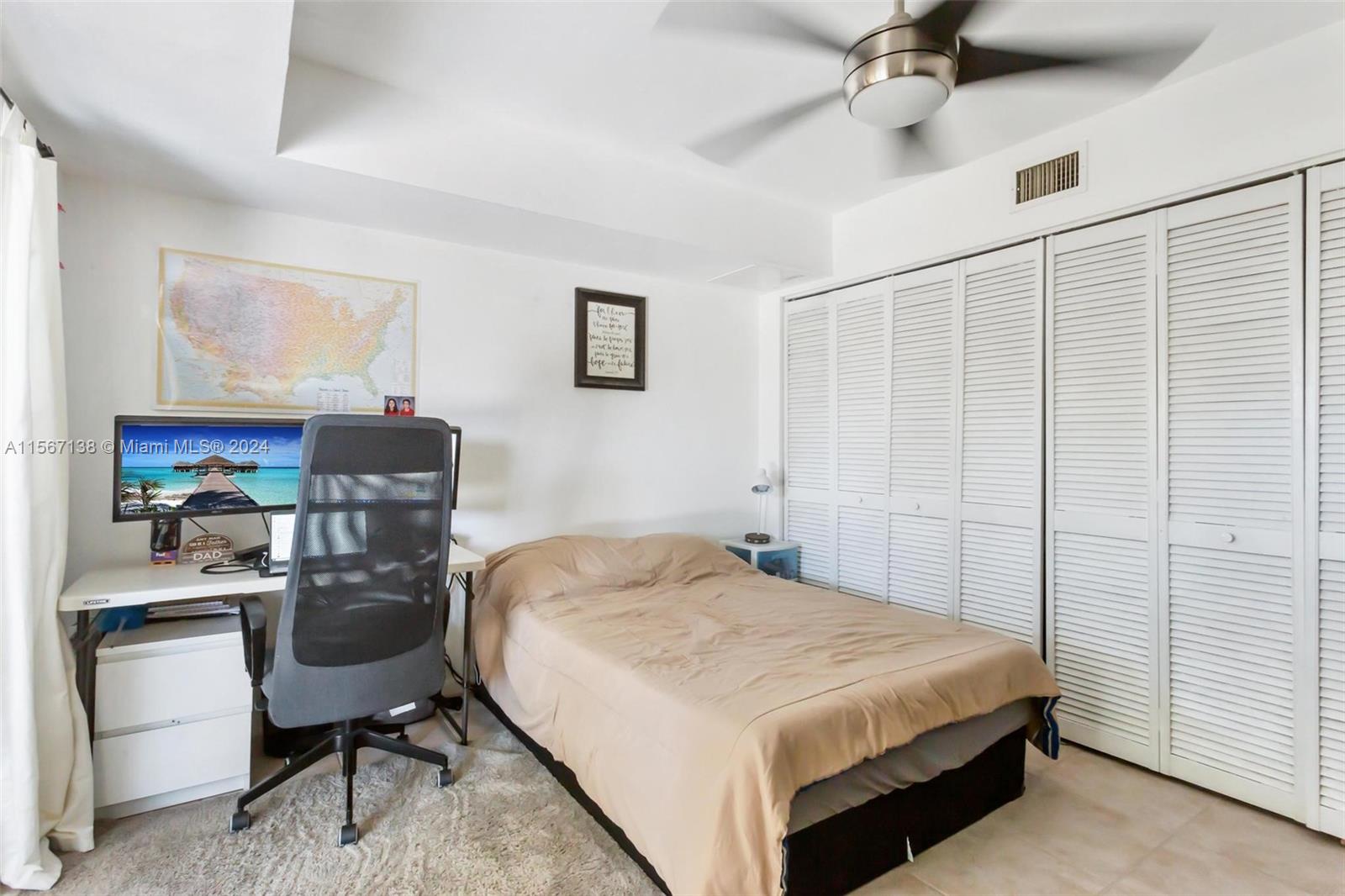 8379 Boca Rio Drive Boca Raton, FL 33433 - Photo 27 of 30 a bedroom that has a bed and a chair in it