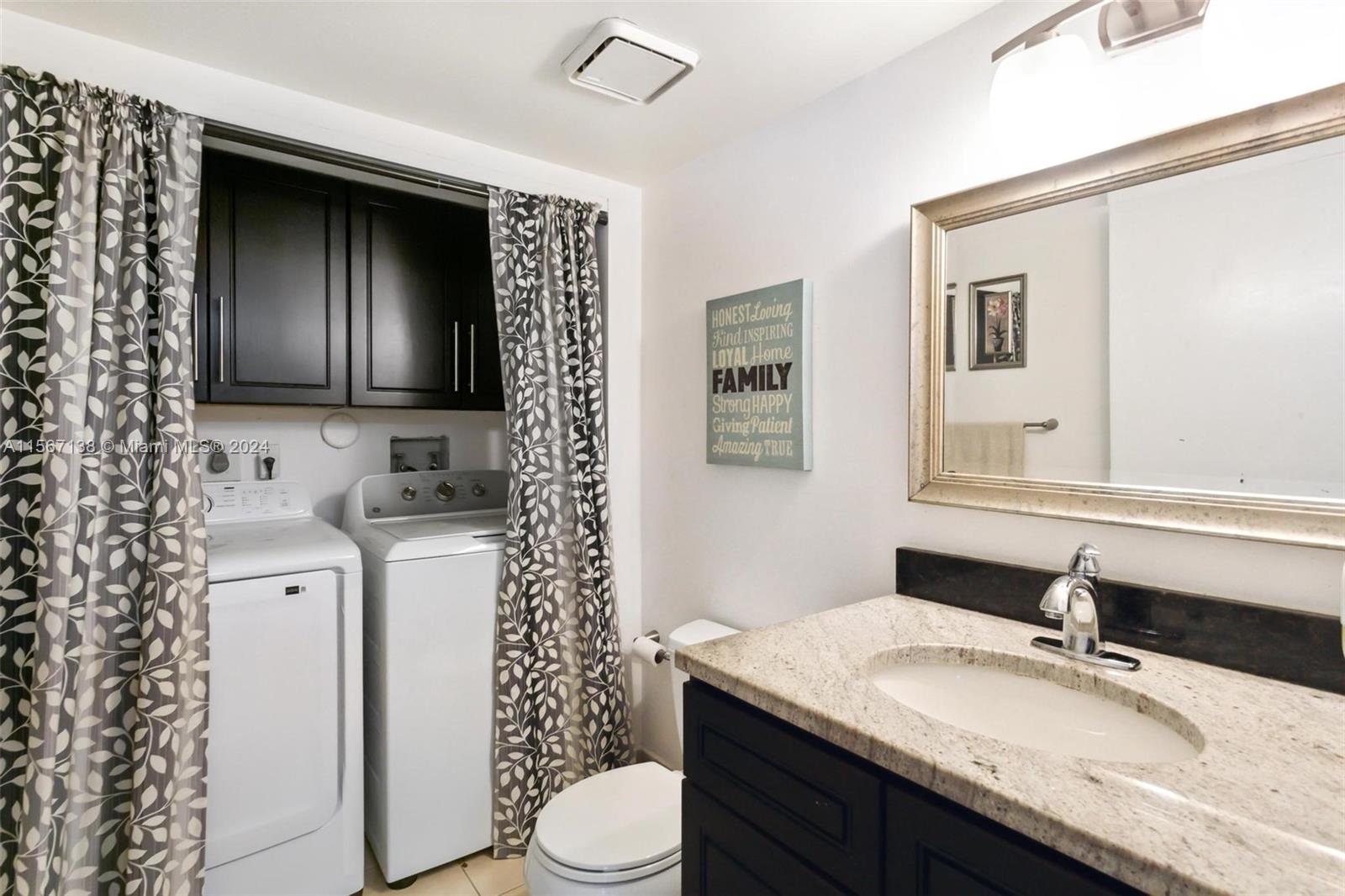 8379 Boca Rio Drive Boca Raton, FL 33433 - Photo 29 of 30 a bathroom with a granite countertop sink toilet a mirror and shower