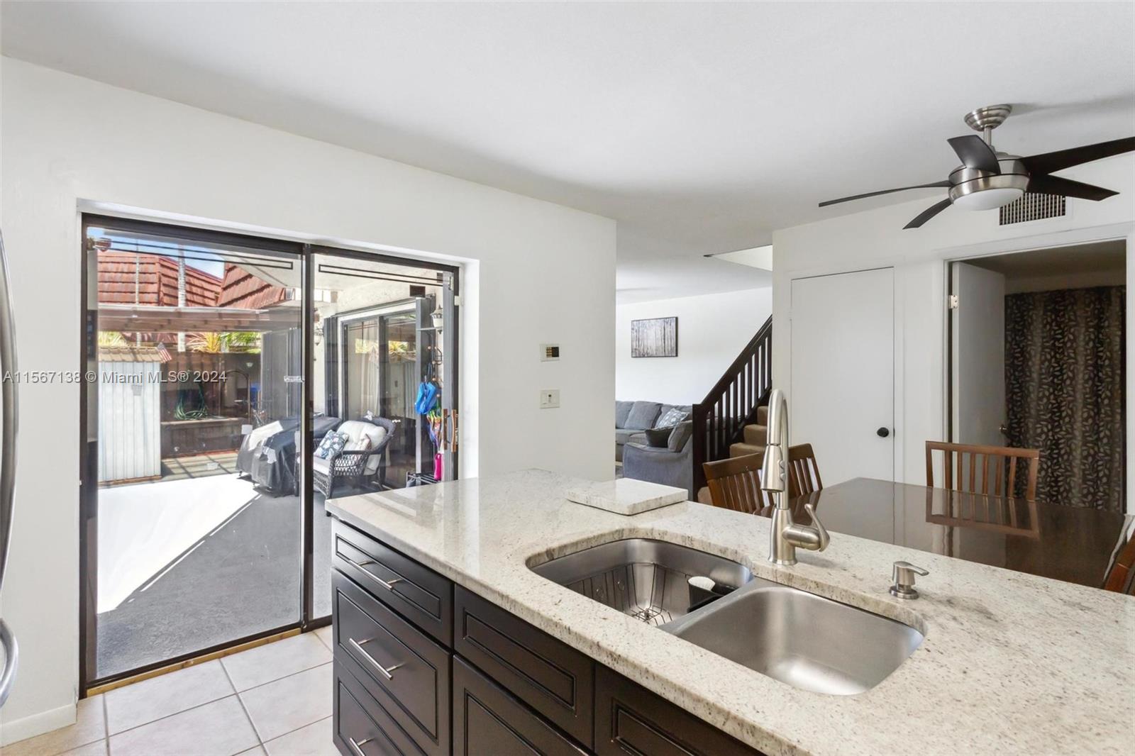 8379 Boca Rio Drive Boca Raton, FL 33433 - Photo 8 of 30 a kitchen with a sink and a refrigerator