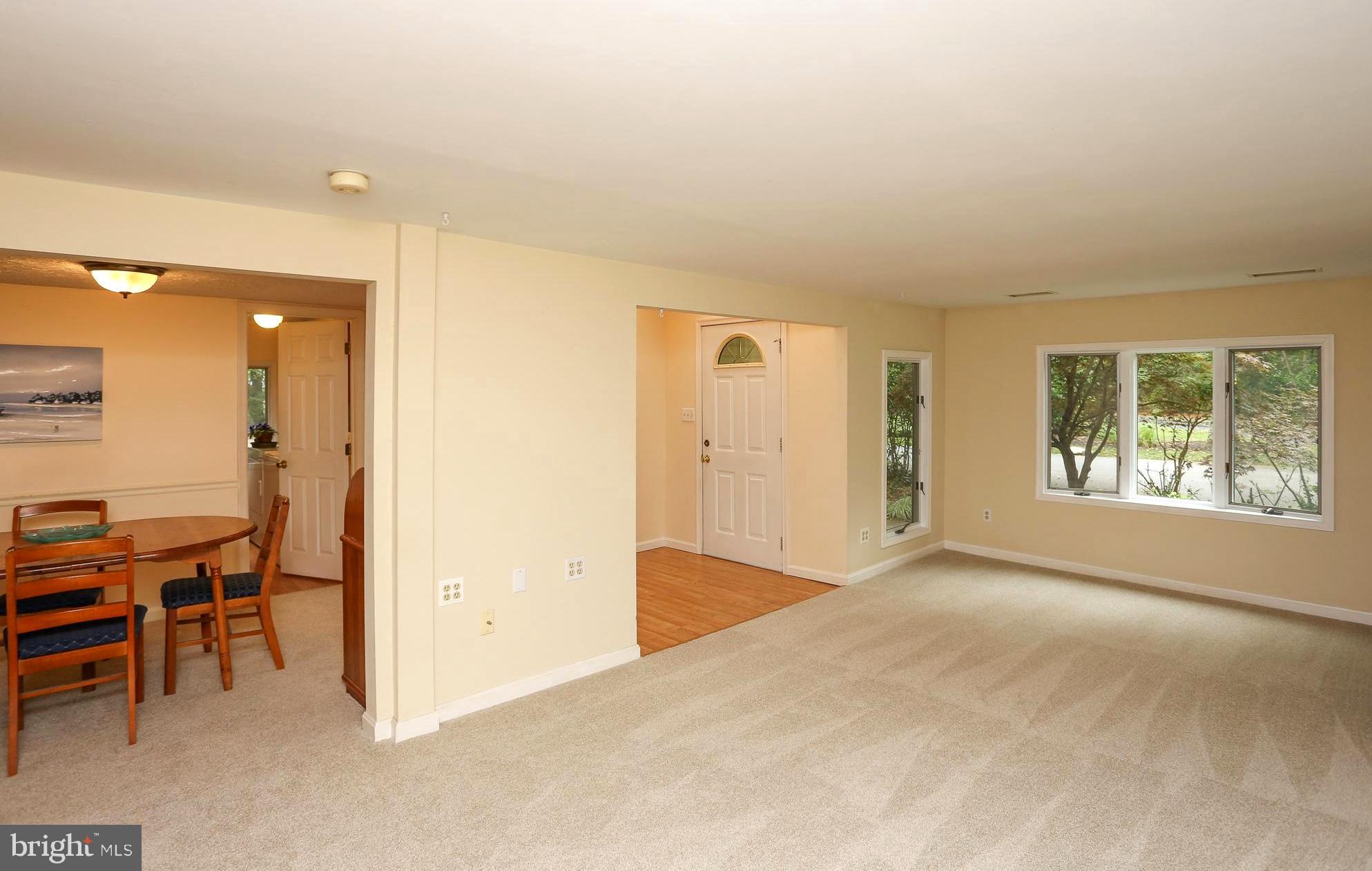 1868 Potomac Road Pasadena, MD 21122 - Photo 22 of 45 Living room and adjacent dining room