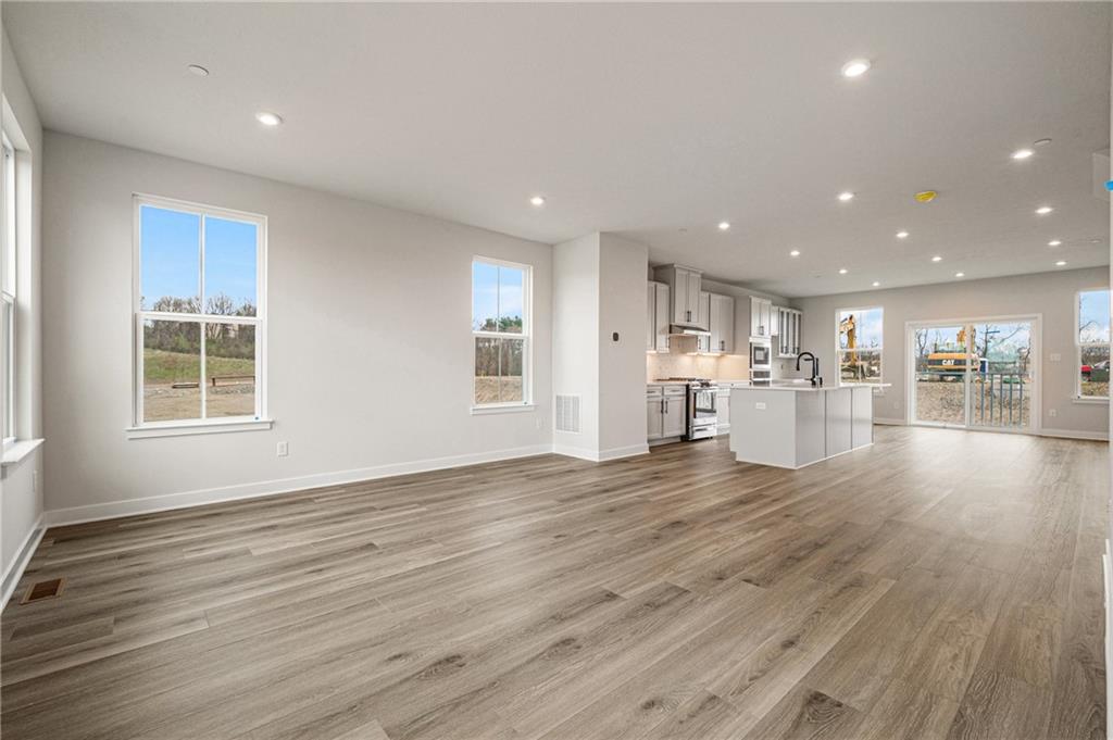 110 Scenic Ridge Drive Venetia, PA 15367 - Photo 12 of 33 an empty room with wooden floor and windows