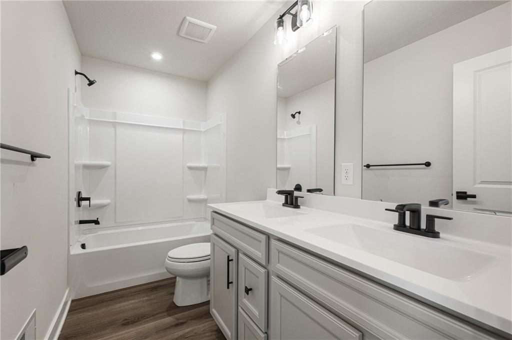 110 Scenic Ridge Drive Venetia, PA 15367 - Photo 24 of 33 a bathroom with a sink a toilet and a large mirror