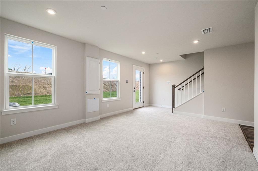 110 Scenic Ridge Drive Venetia, PA 15367 - Photo 9 of 33 a view of an empty room with a window and a kitchen