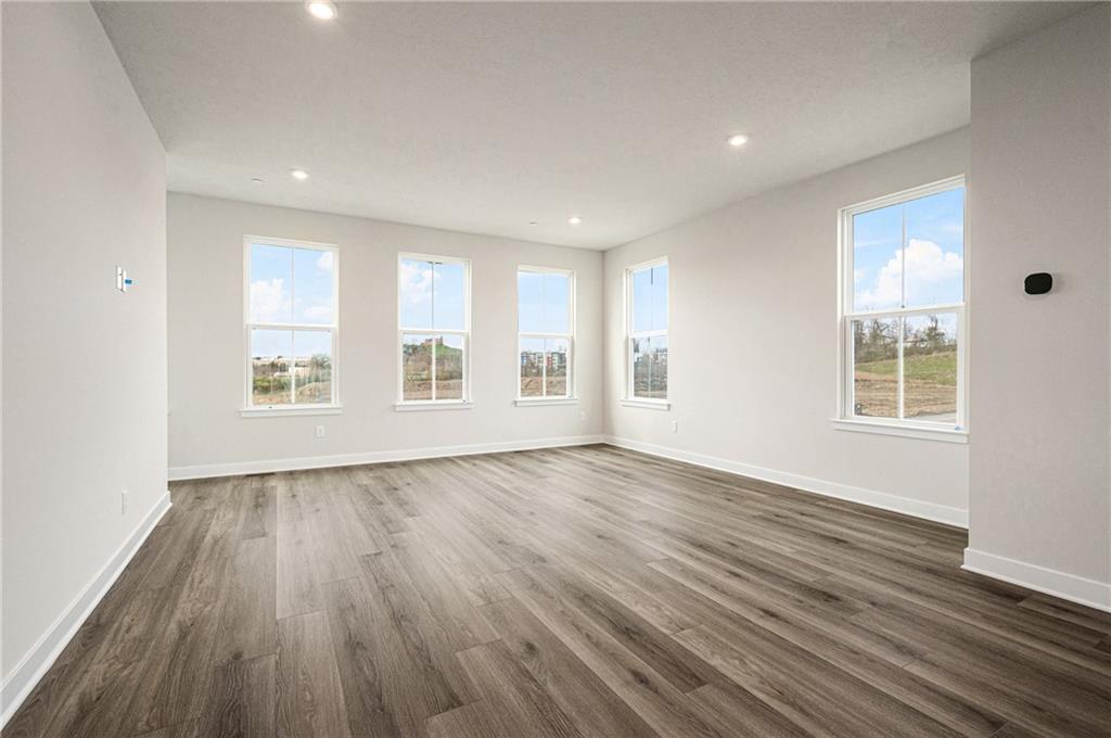 110 Scenic Ridge Drive Venetia, PA 15367 - Photo 10 of 33 an empty room with wooden floor and windows