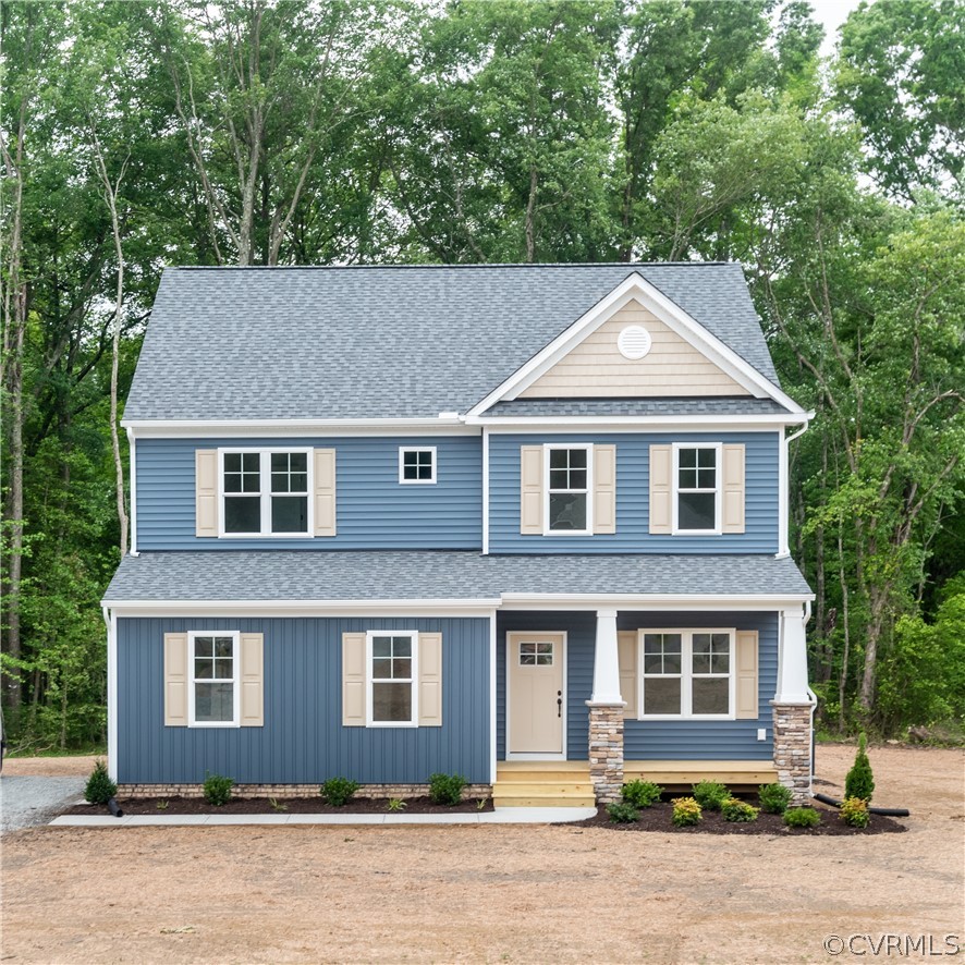 a front view of a house with a yard and street view