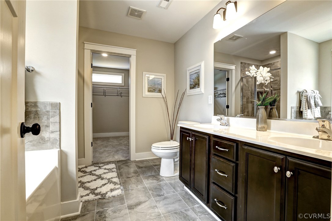 4913 Appelman Ridge Chesterfield, VA 23832 - Photo 16 of 21 a bathroom with a double vanity sink toilet and shower