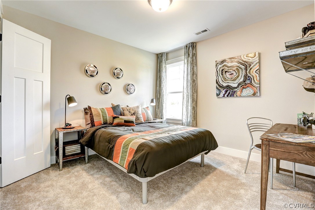 4913 Appelman Ridge Chesterfield, VA 23832 - Photo 18 of 21 a bedroom with a bed and a table