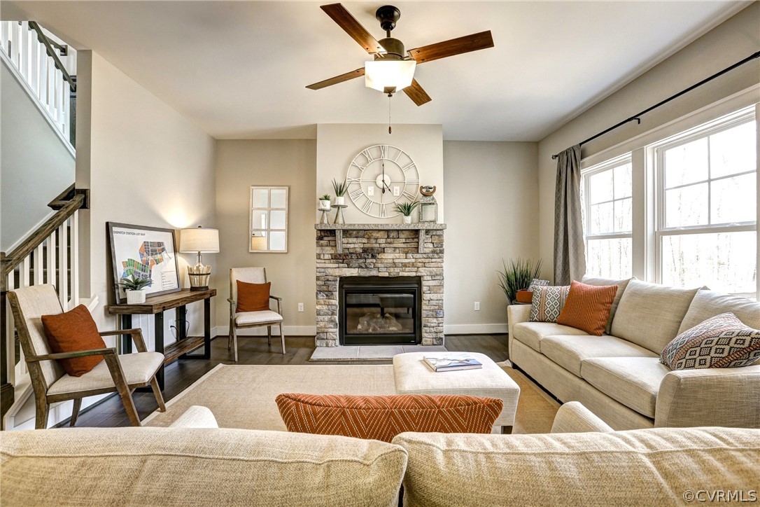 4913 Appelman Ridge Chesterfield, VA 23832 - Photo 6 of 21 a living room with furniture a fireplace and a chandelier