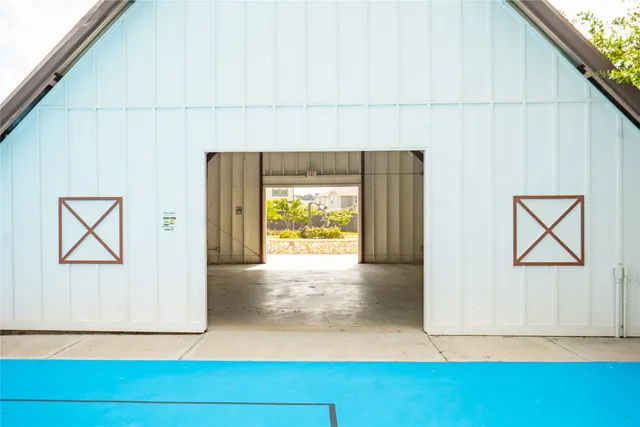 a view of a house with a yard and a garden