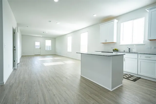 an aerial view of a house with outdoor space