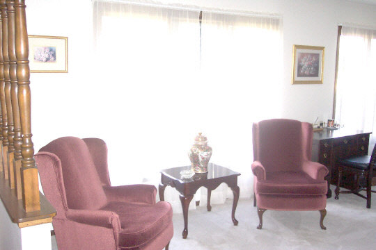 6449 Rendova Court Roscoe, IL 61073 - Photo 2 of 6 a chair and a table in a room