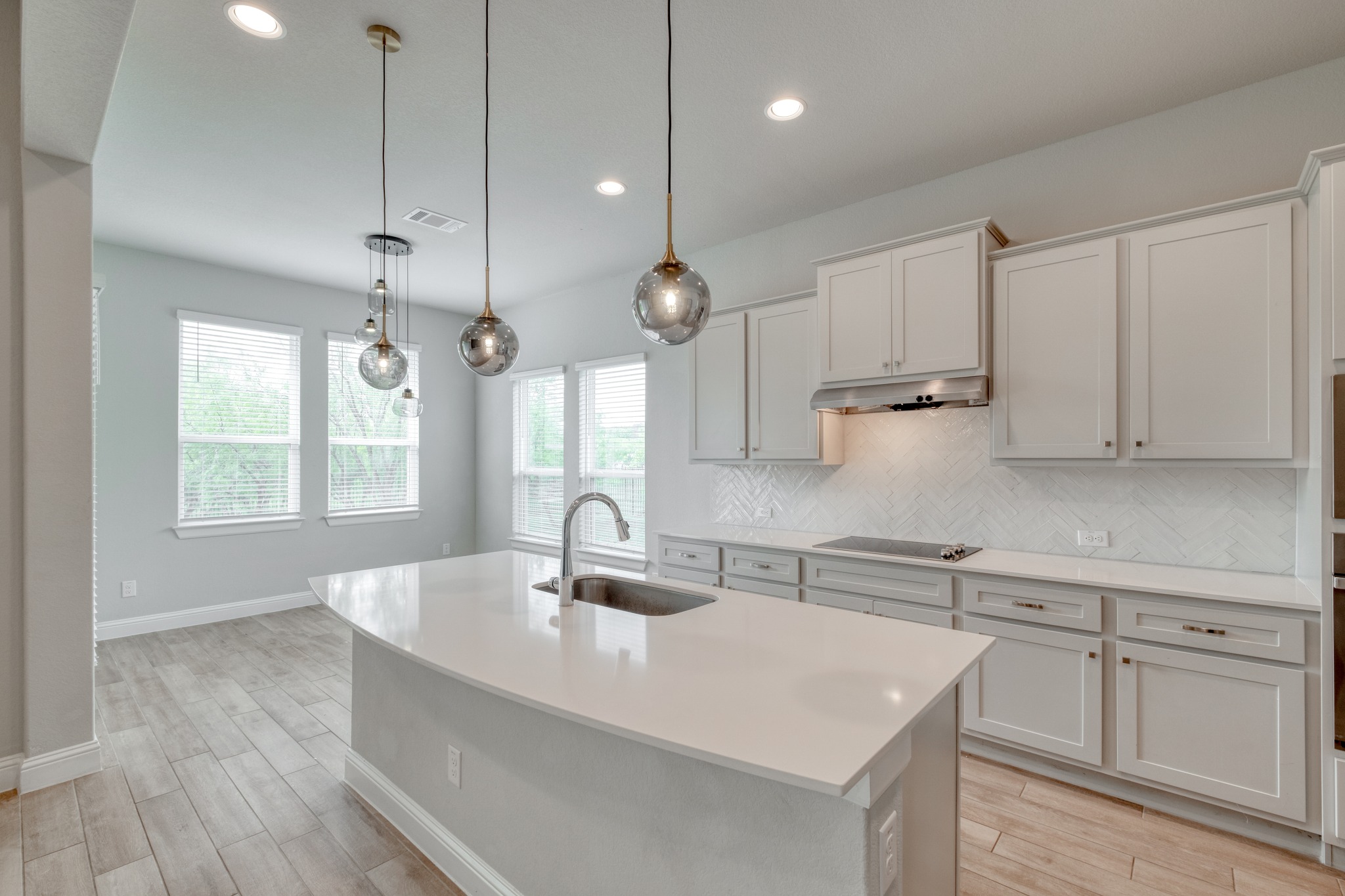 359 Raptor Beak Way Cedar Creek, TX 78612 - Photo 7 of 29 This kitchen is a standout with its white cabinetry and quartz countertops that offer plenty of room for holiday meal prep