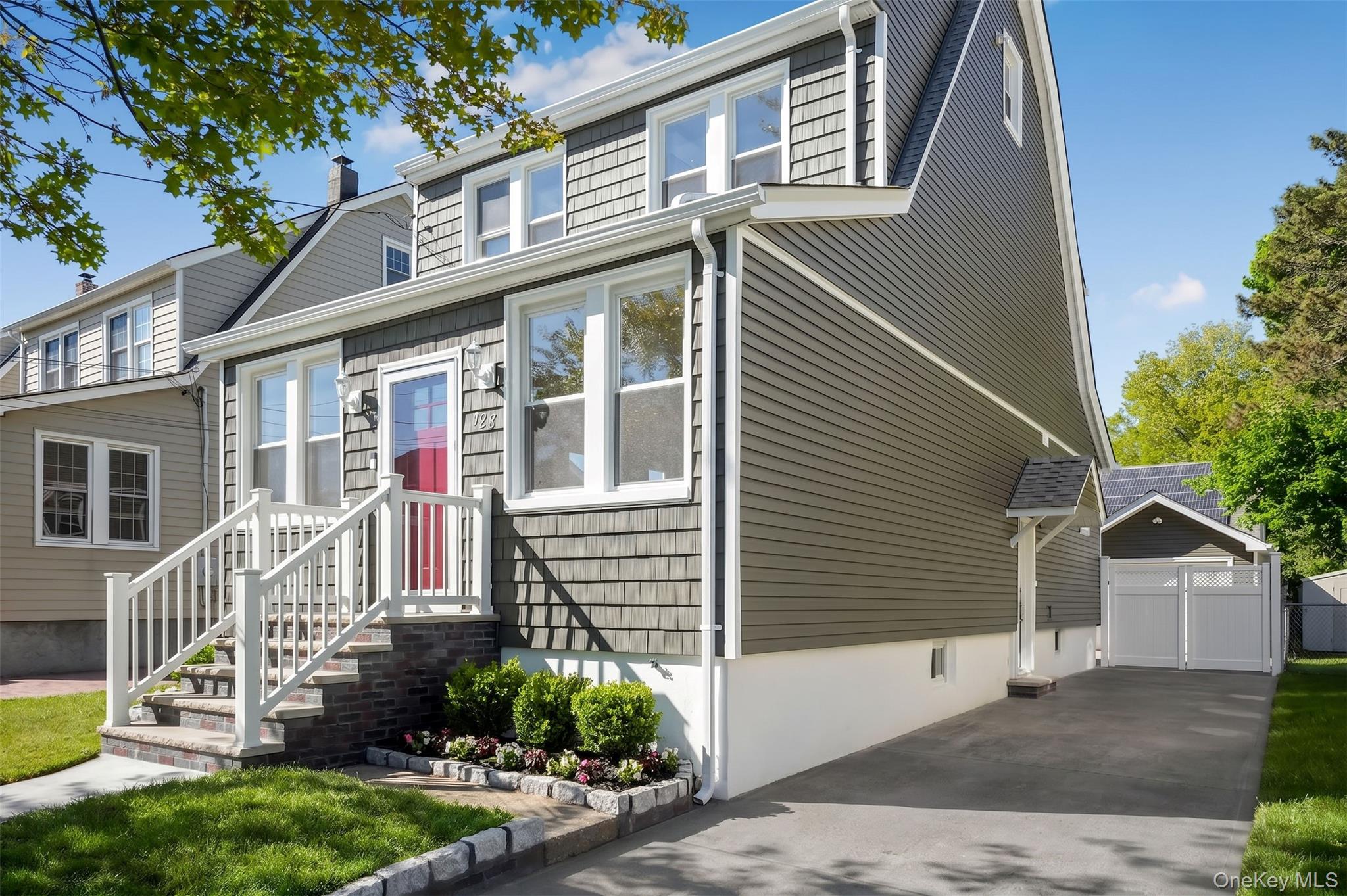 123 East Maple Street Valley Stream, NY 11580 - Photo 2 of 11 a front view of a house with a yard
