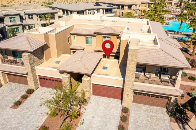 a large bathroom with a granite countertop double vanity sink a mirror and a bathtub