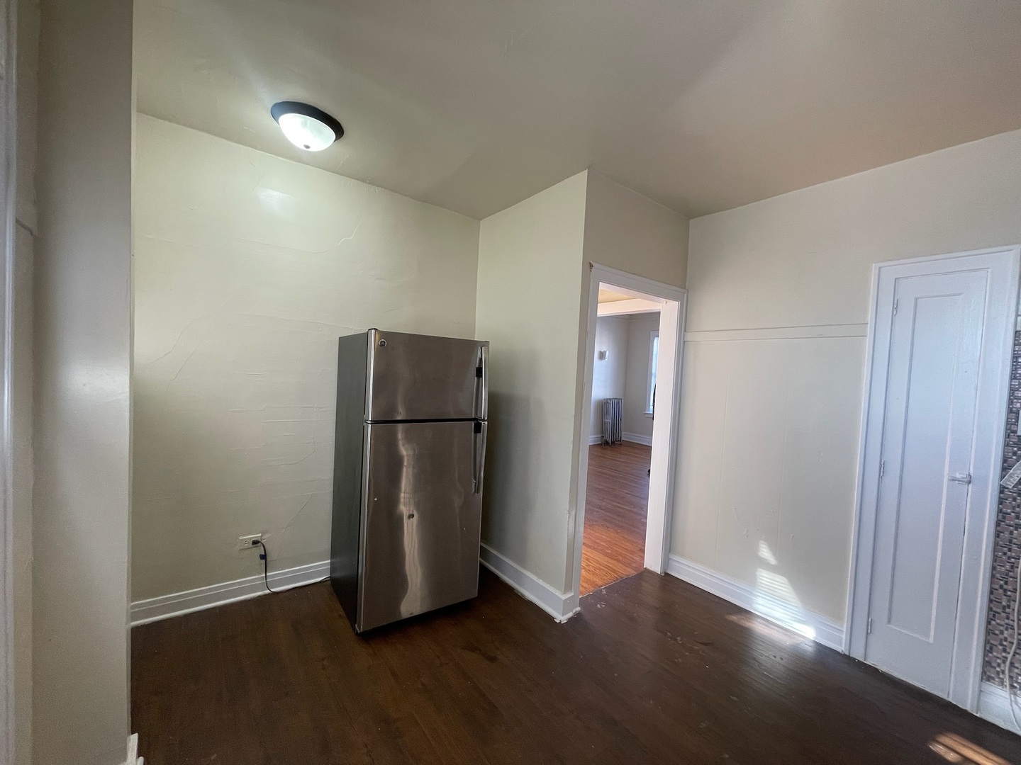 117 East 68th Street, Unit 3 Chicago, IL 60637 - Photo 4 of 17 a view of an empty room with closet and a window