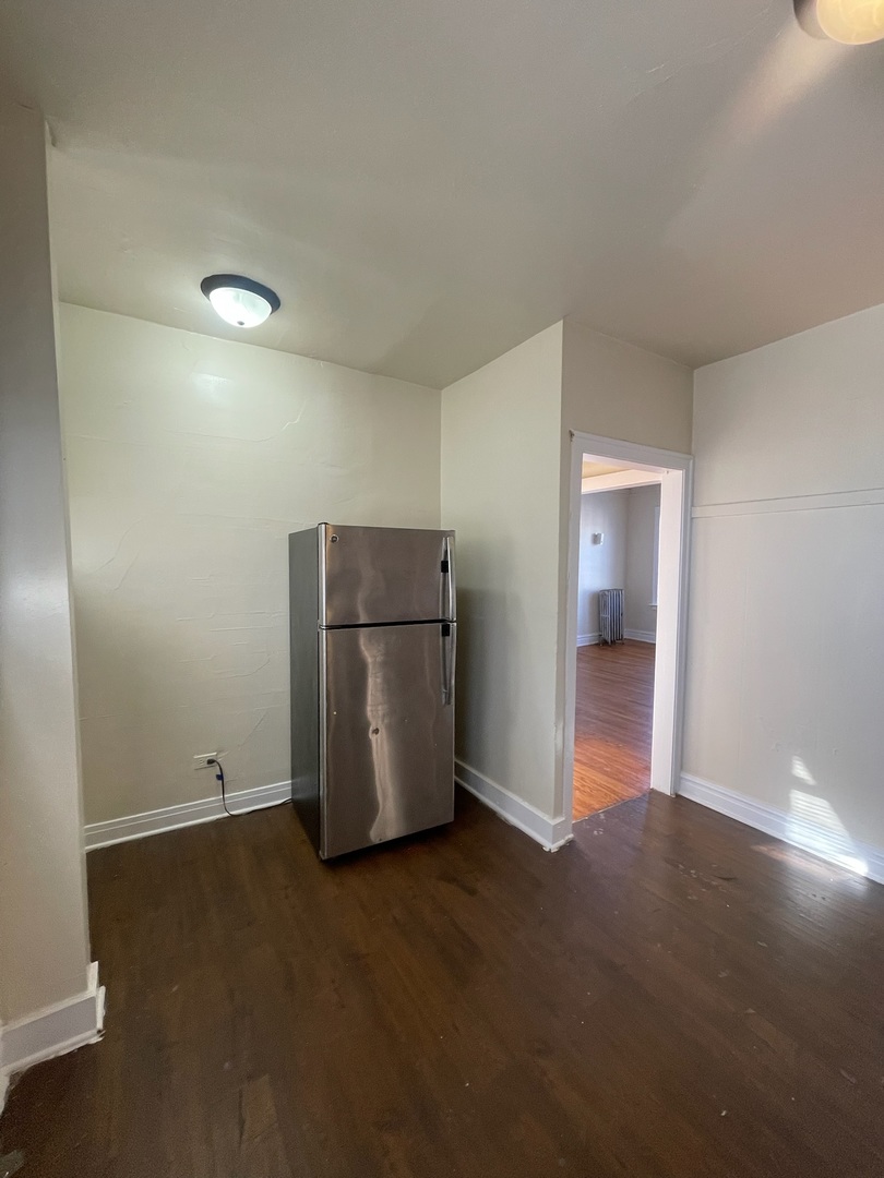 117 East 68th Street, Unit 3 Chicago, IL 60637 - Photo 5 of 17 a view of room with window