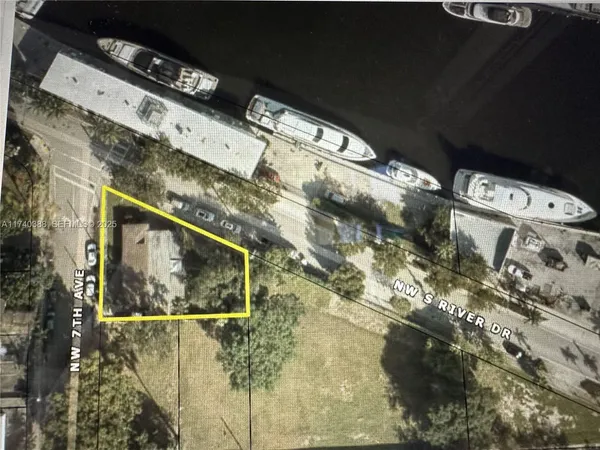 a blue sign that is on the side of a building