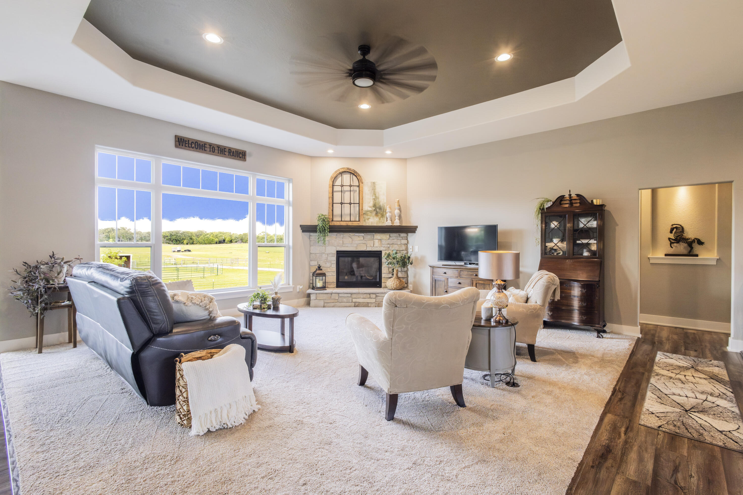 S75W35724 Wilton Road Eagle, WI 53119 - Photo 4 of 42 Relax in the open family room with views into the pasture. Tray ceiling and cozy fireplace.