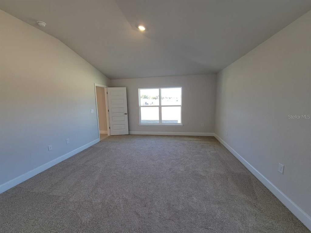4537 Southwest 91st Ln Road Ocala, FL 34476 - Photo 10 of 18 an empty room with a window