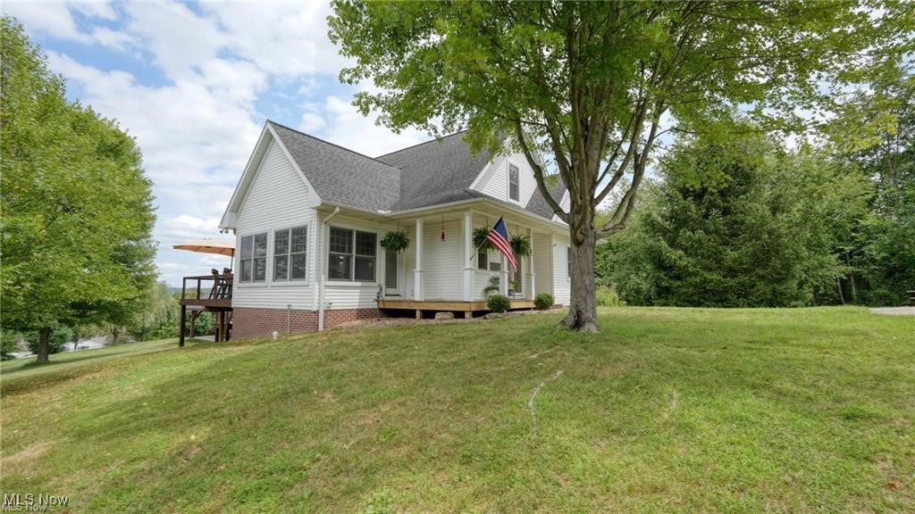 66333 Read Road Cambridge, OH 43725 - Photo 2 of 49 View of side of home featuring a yard