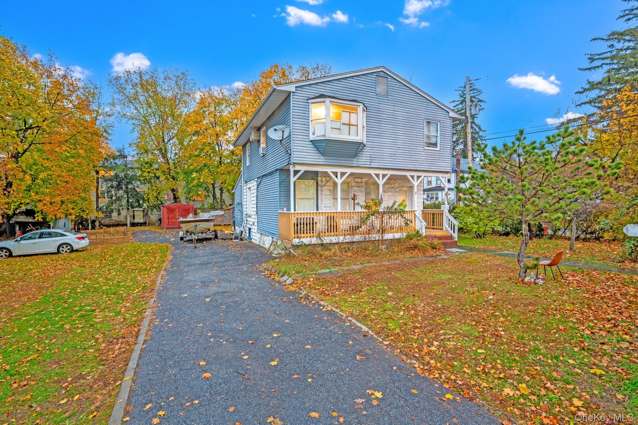 17 Division Avenue Spring Valley, NY 10977 - Photo 2 of 4 a front view of a house with a yard
